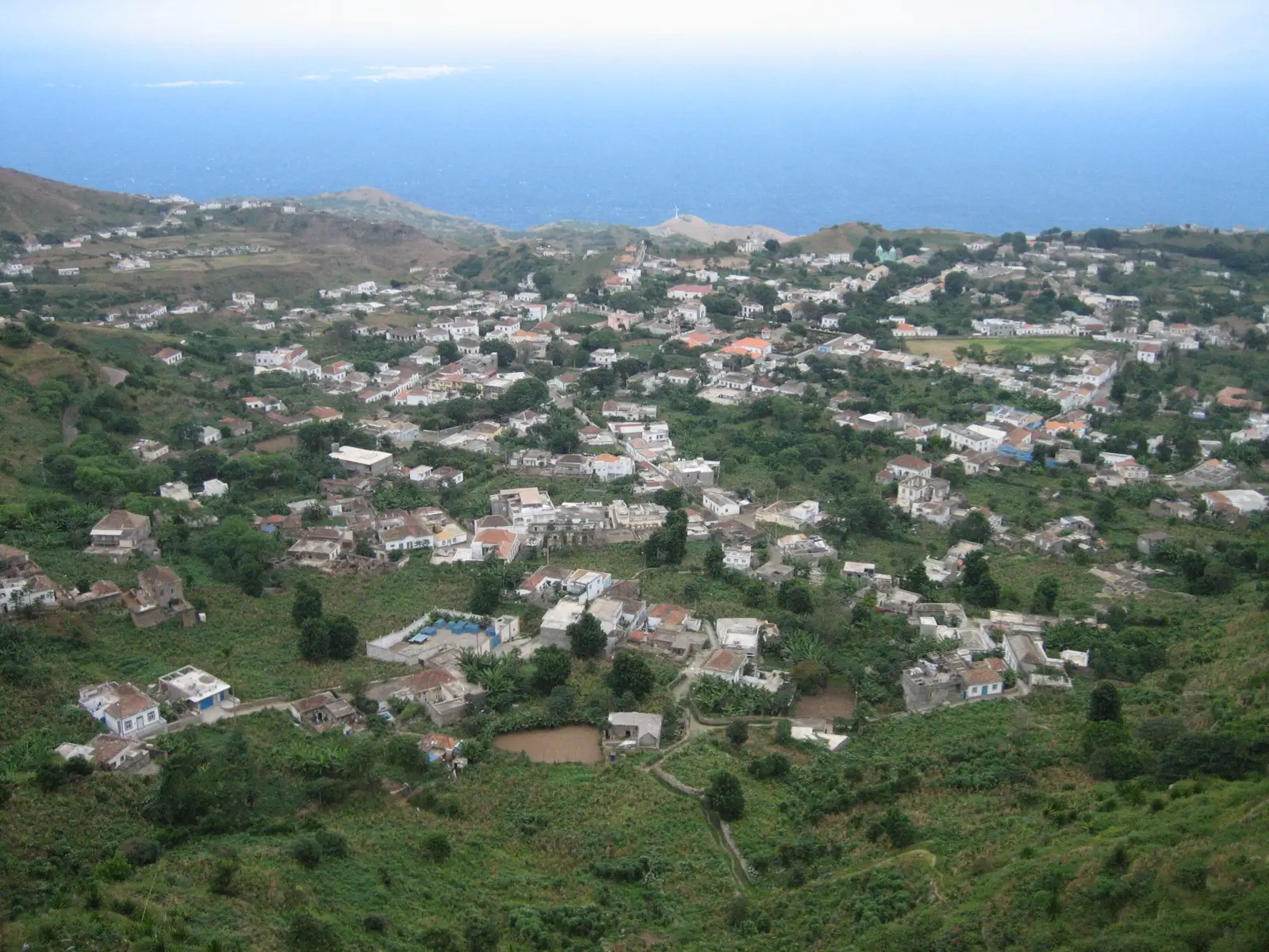 Vila Nova Sintra spread across Brava’s green crater plateau with the Atlantic beyond